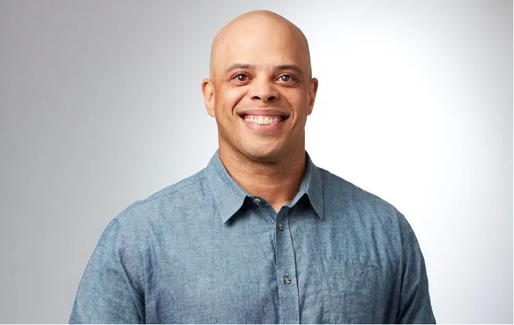 A headshot of Adobe CIO Lucius DiPhillips