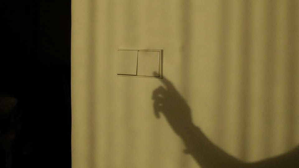 A shadow of someone's hand appears as if it is pressing a light switch. ChatGPT was knocked offline for 16 hours after an Ubuntu update in June