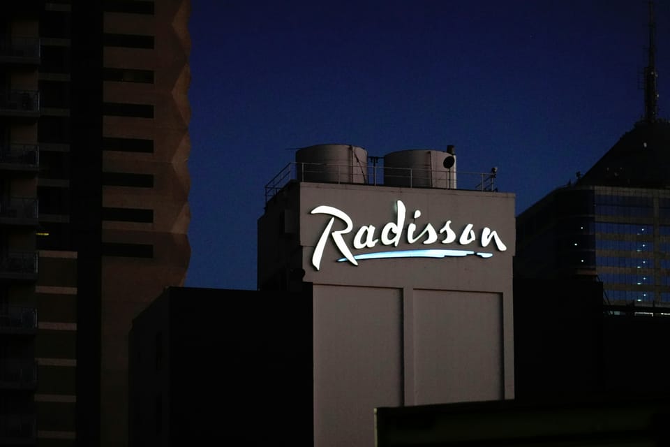 The Radisson logo on a building. Radisson Hotel Group migrated its entire SAP landscape to the cloud