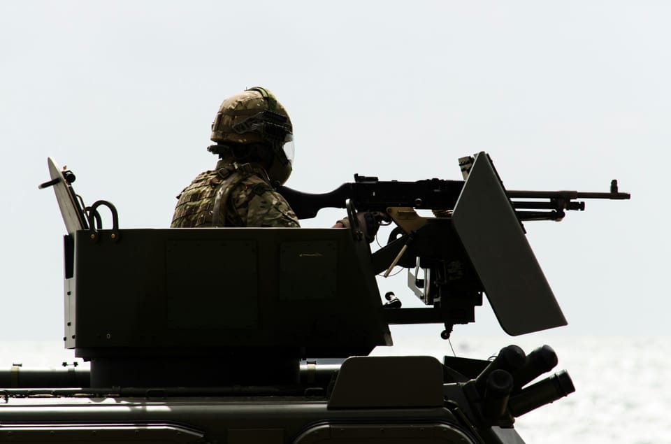 A British Army soldier using a gun mounted onto a tank. The Army will spend up to £216 million on AI-powered target decision making technology