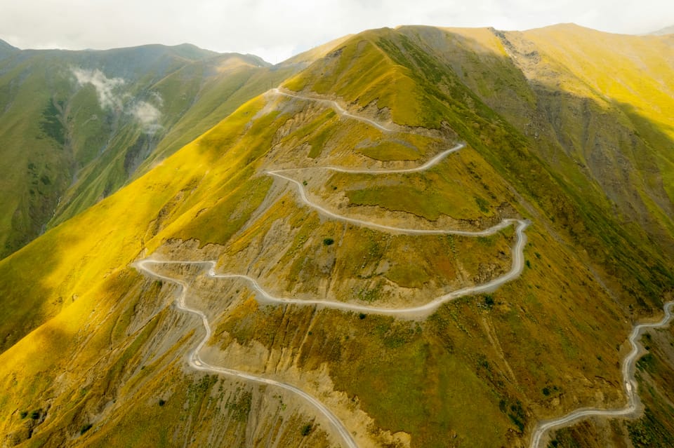 A footpath zig zags up a mountain. Zig has left GitHub for Codeberg.