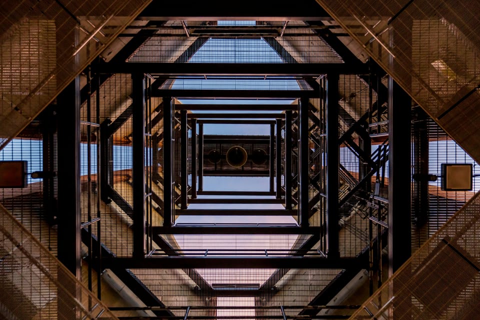 A metal structure seen from below. The Technology Services 4 Framework includes Fujitsu.