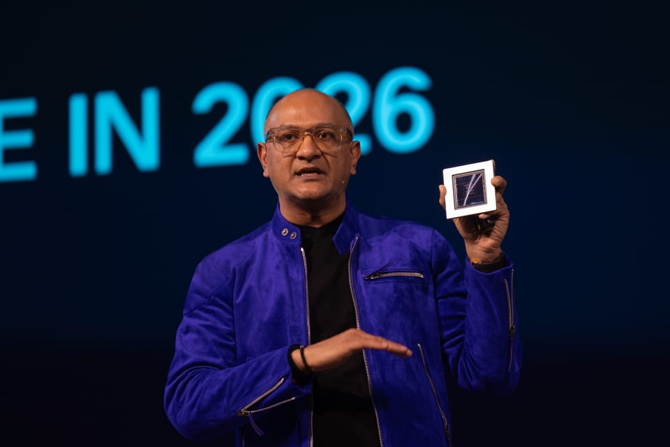 Cisco President Jeetu Patel holds the  G300 chip on stage at Cisco Live EMEA